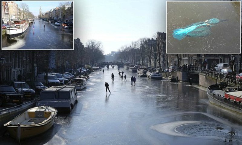 Из-за небывалых морозов каналы Амстердама превратились в каток (14 фото)